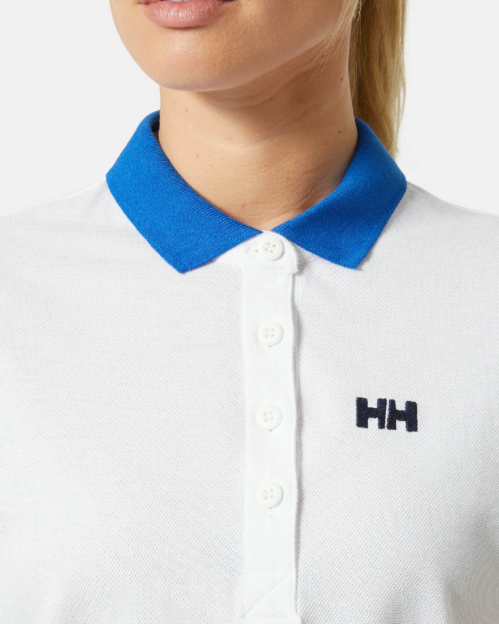 White coloured Helly Hansen Womens Pier Pique Polo Shirt on grey background 