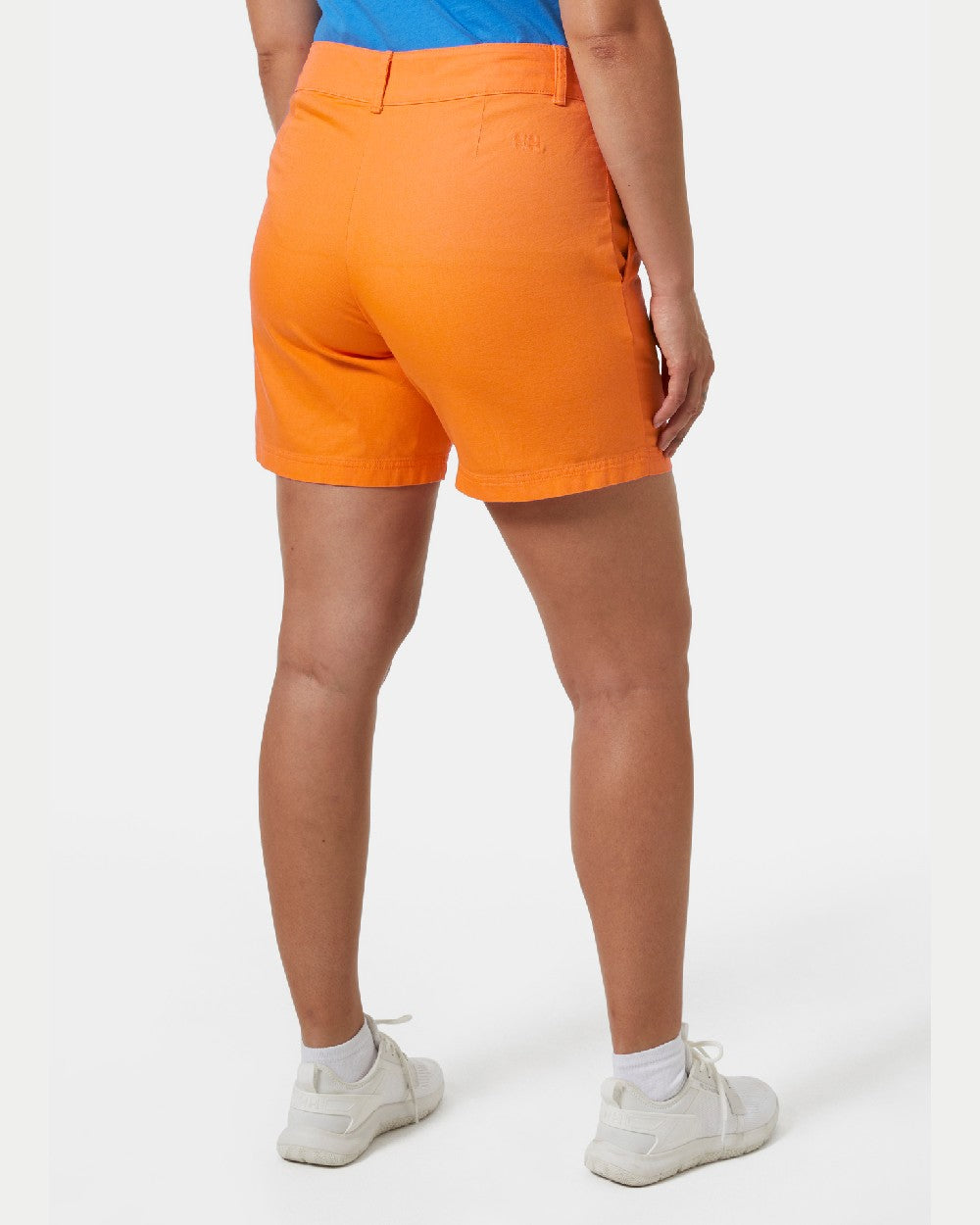 Poppy Orange coloured Helly Hansen Womens Pier Shorts on grey background 