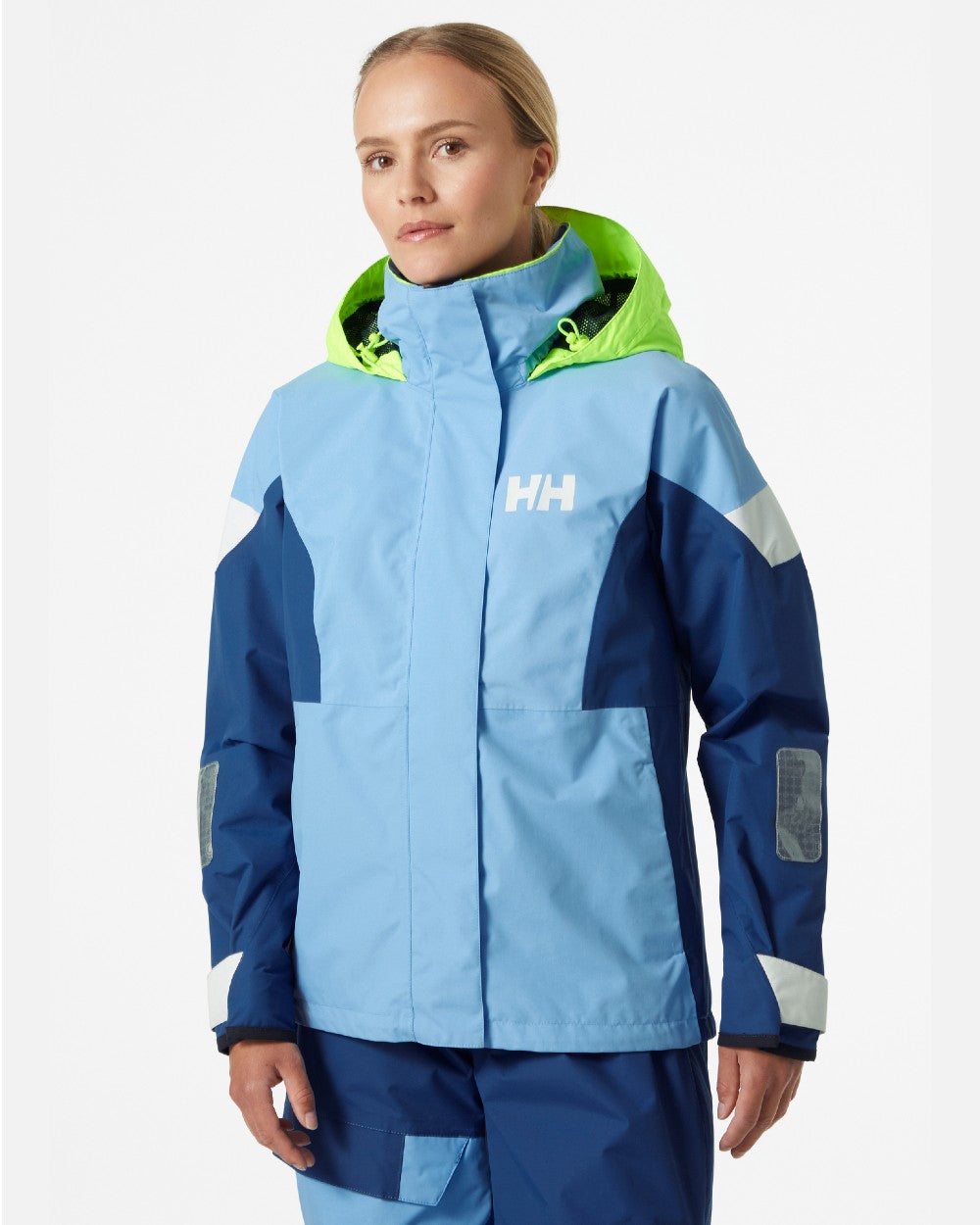 Bright Blue coloured Helly Hansen Womens Newport Regatta Sailing Jacket on grey background 