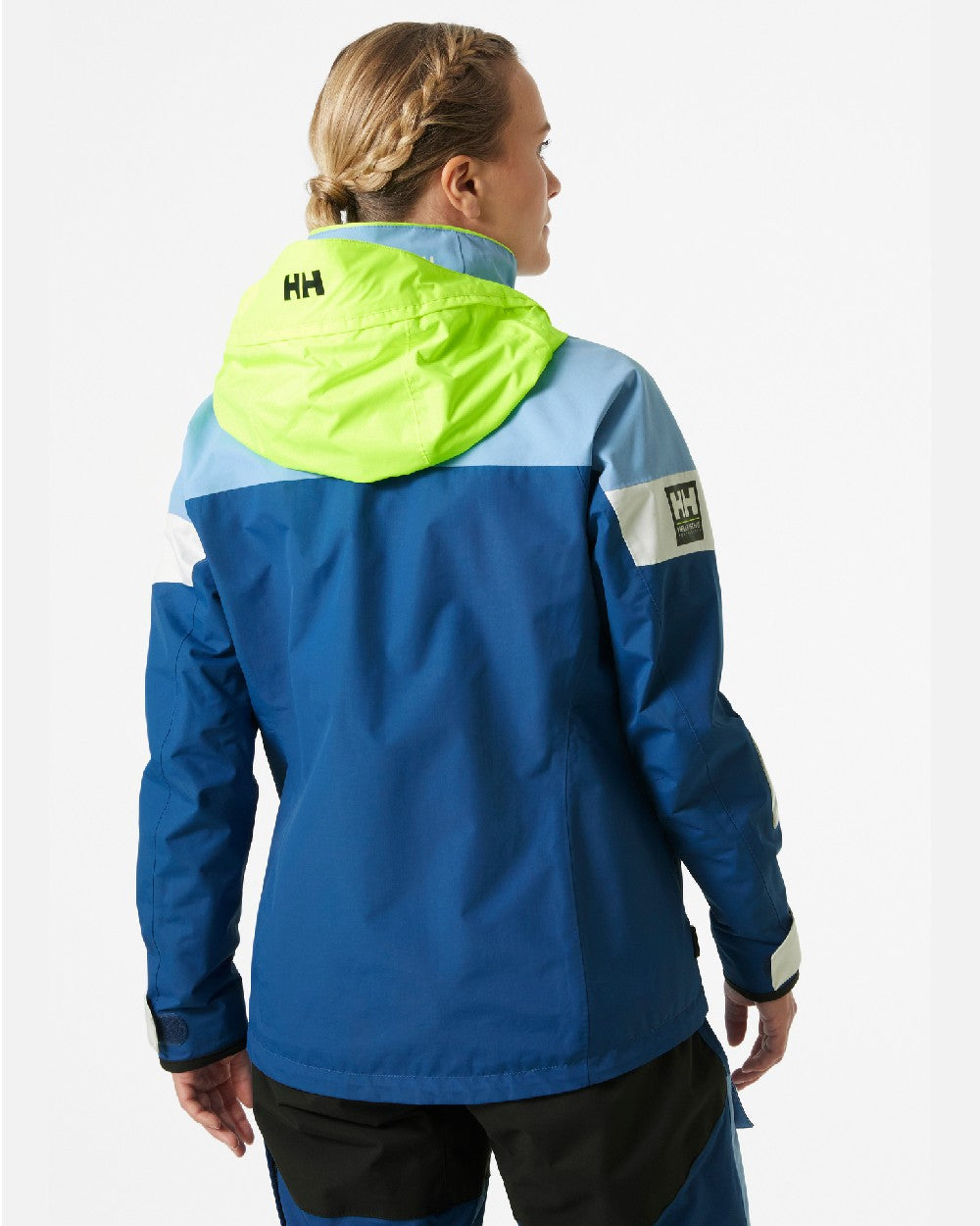 Bright Blue coloured Helly Hansen Womens Newport Regatta Sailing Jacket on grey background 