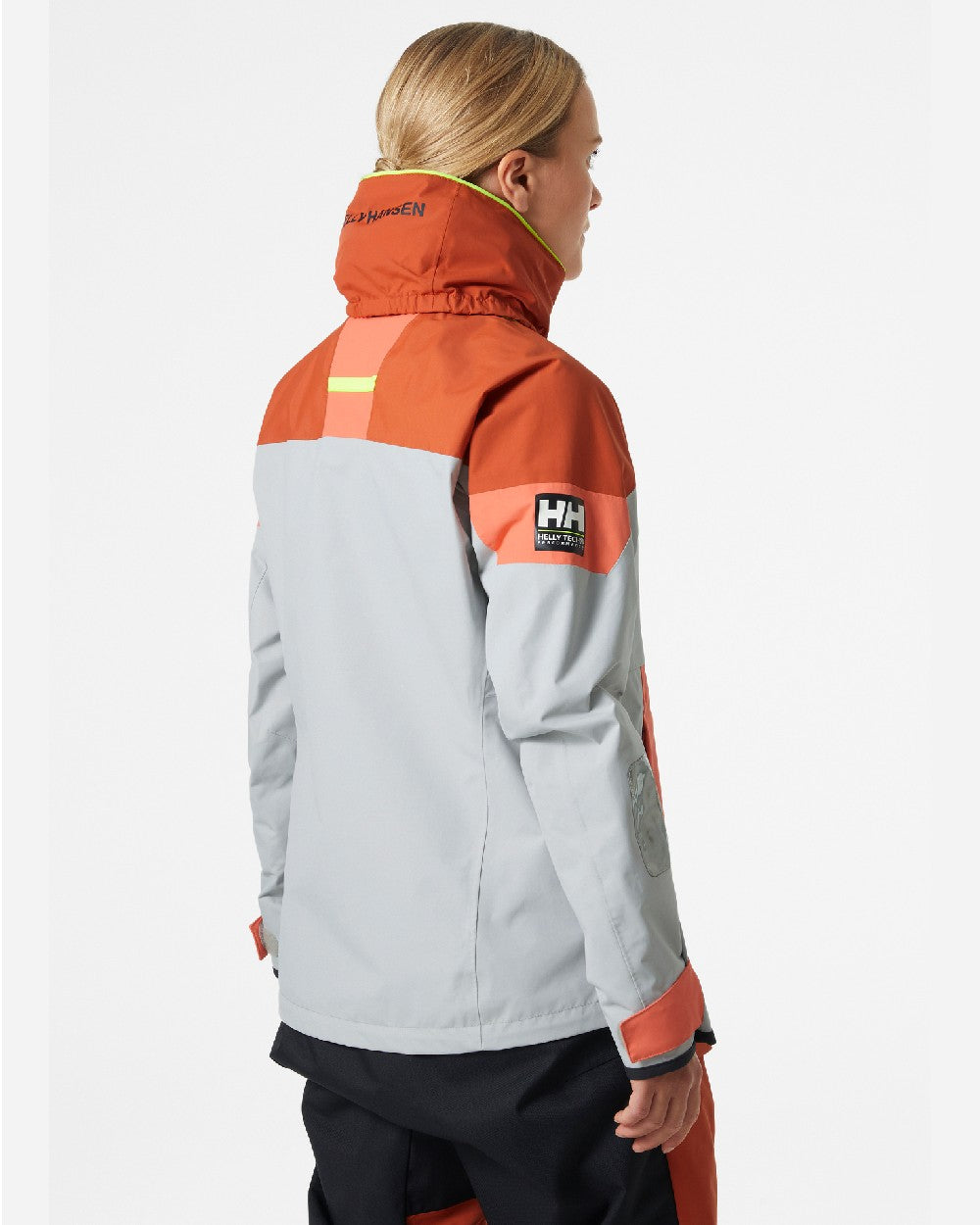 Terracotta coloured Helly Hansen Womens Newport Regatta Sailing Jacket on grey background 