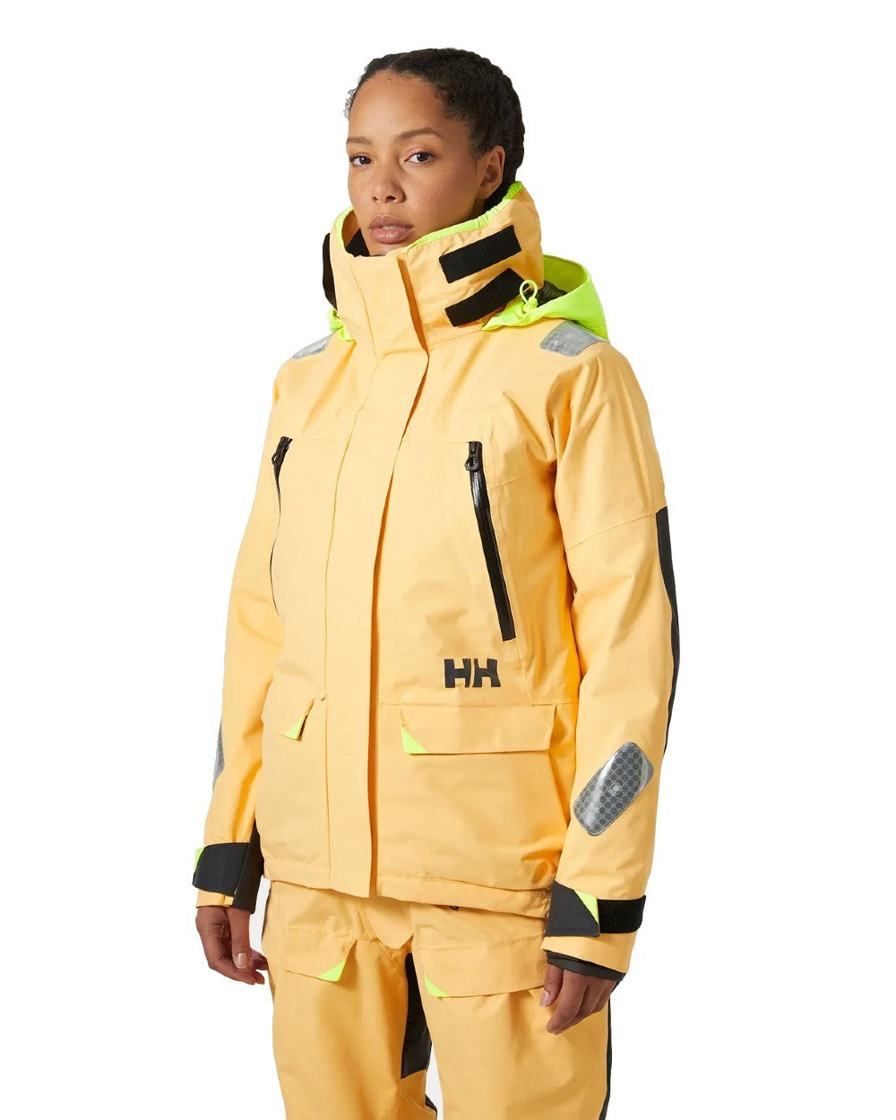 Miami Peach coloured Helly Hansen Womens Skagen Offshore Sailing Jacket on white background 