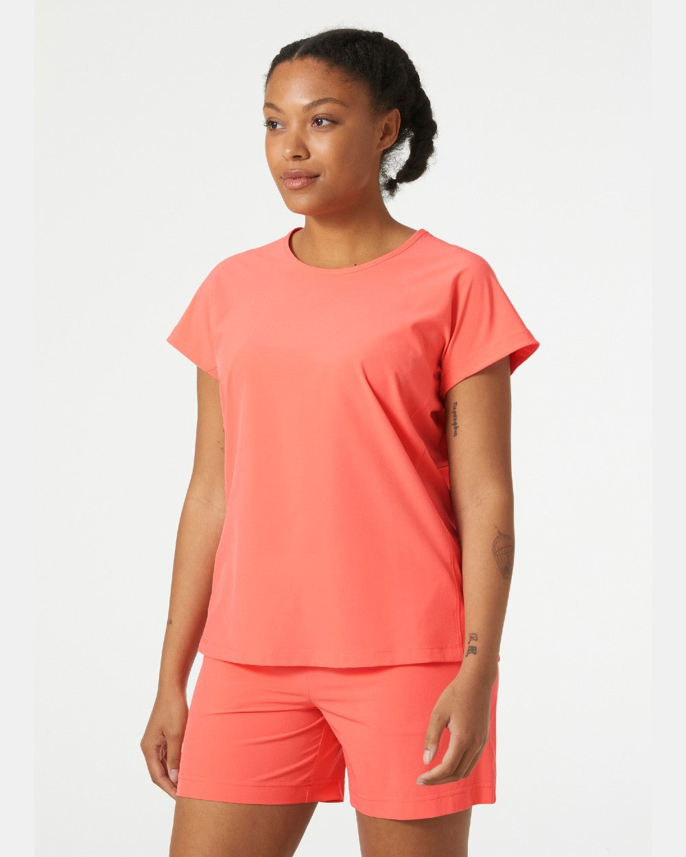 Peach Echo coloured Helly Hansen Womens Thalia Summer Top on grey background 