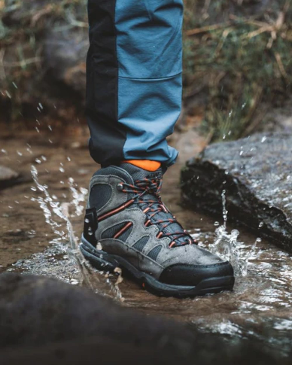 Charcoal Graphite Burnt Orange Coloured Hi-Tec Bandera Lite II Waterproof Hiking Boots On A Forest Background