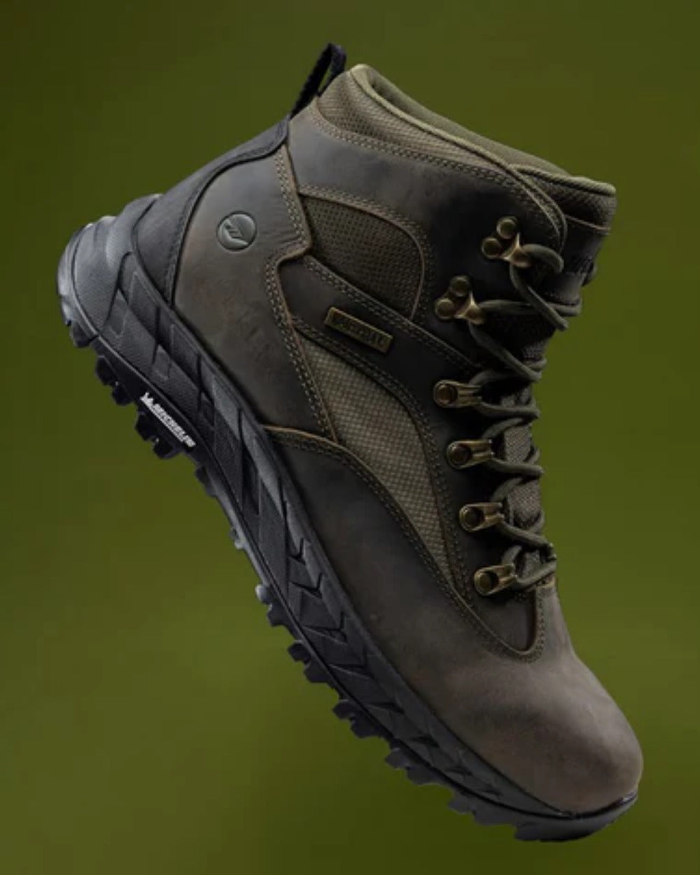 Khaki Coloured Hi-Tec Mens Euro Trail Boots On A Blurry Background