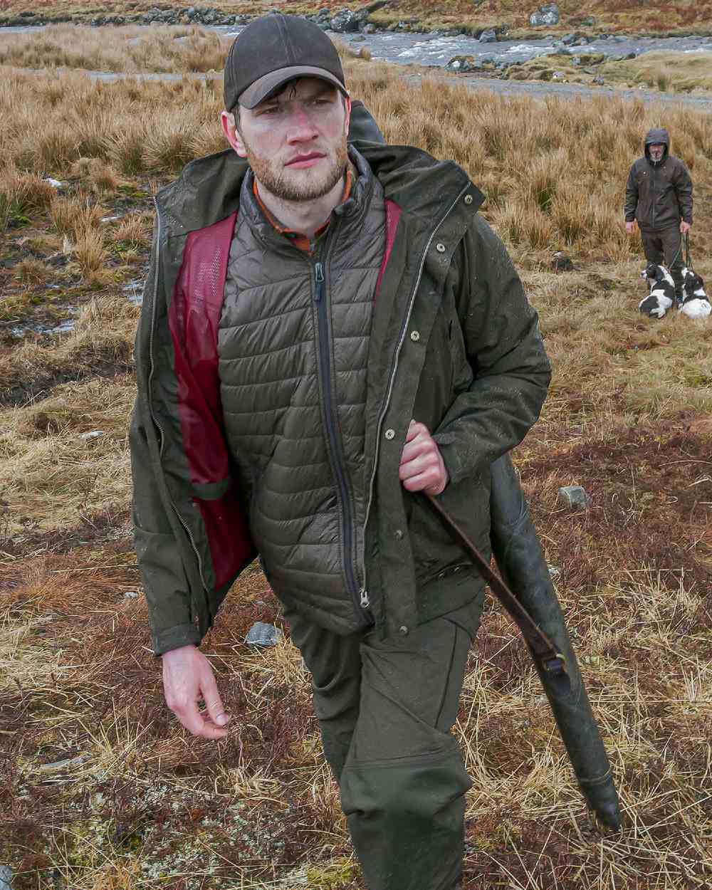 Fern Green coloured Hoggs of Fife Culloden Waterproof Field Jacket on barn background 