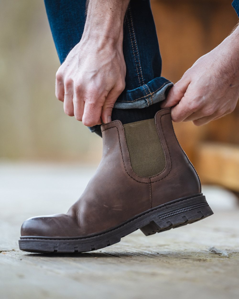 Dark Brown Coloured Hoggs of Fife Dalmeny Dealer Boots On A brown Background 