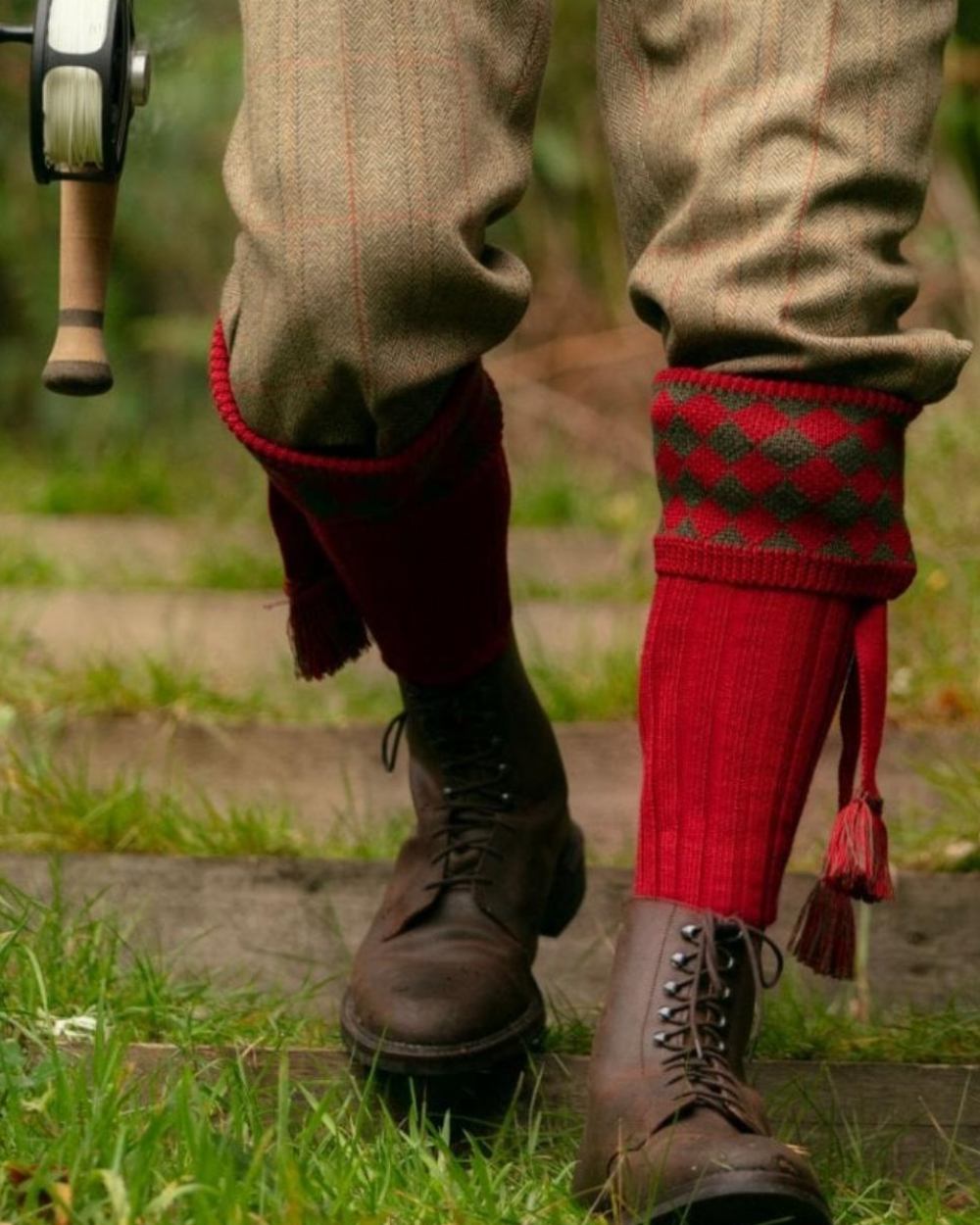 Brick Red Coloured House of Cheviot Chessboard Socks On A Forest Background 