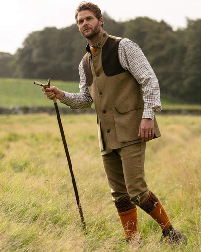 Ochre coloured House of Cheviot Tayside Socks on field background 