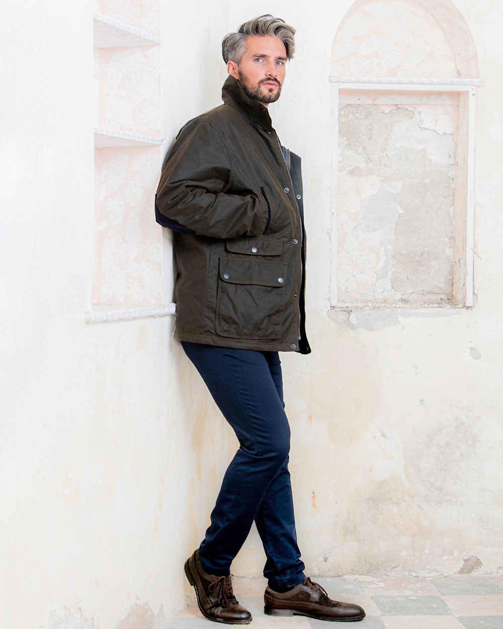 Olive coloured Jack Murphy Archie Wax Jacket on White wall background 