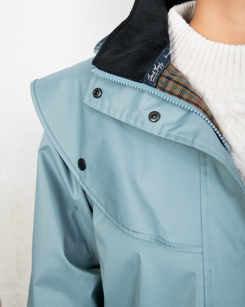 Smoke Blue coloured Jack Murphy Cotswold Ladies Waterproof 3/4 Coat on Teal background 