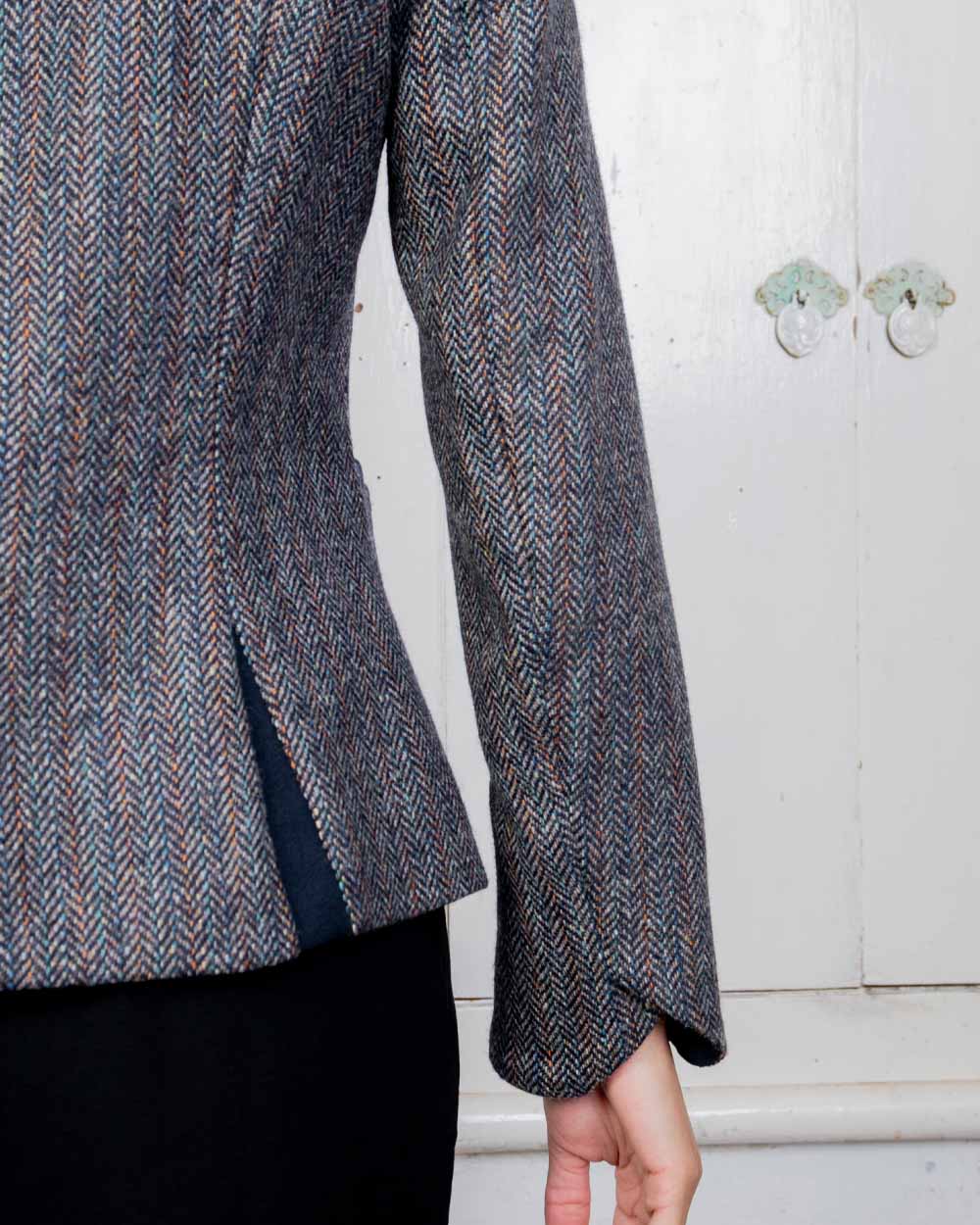 Blue Moon Herringbone Coloured Jack Murphy Sasha Tweed Jacket on indoor background 