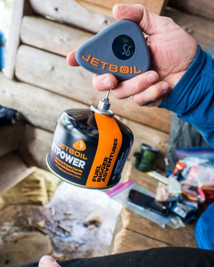 Jetboil Jet Gauge Fuel Level Measuring Tool On A Backyard Background