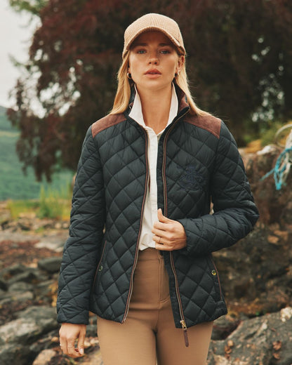 Navy Coloured Joules Braemar Luxe Jacket On A Forest Background 