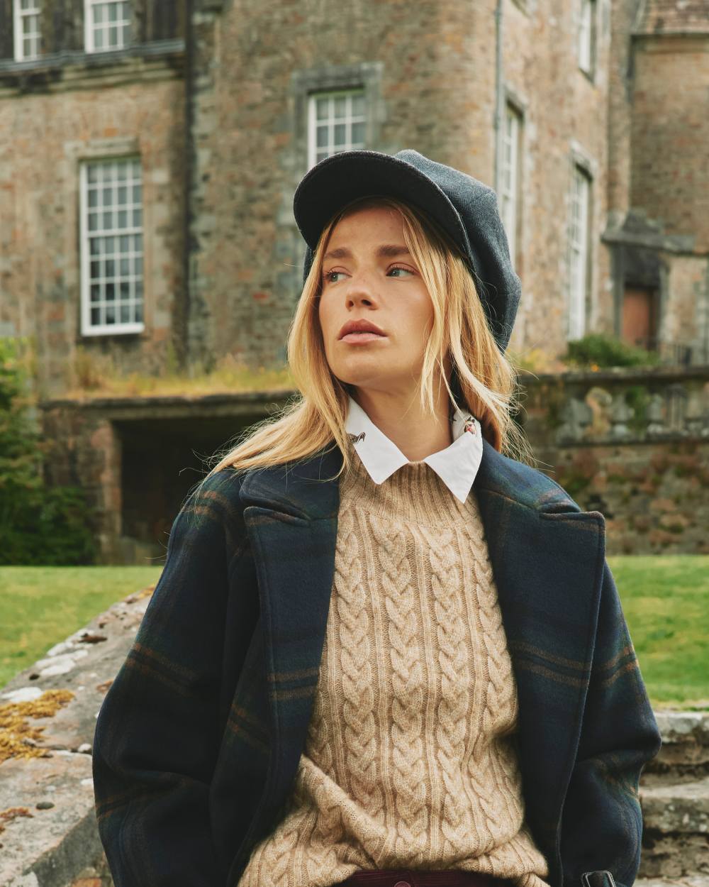 Navy Coloured Joules Elvaston Baker Boy Hat On A Outer Yard Background 