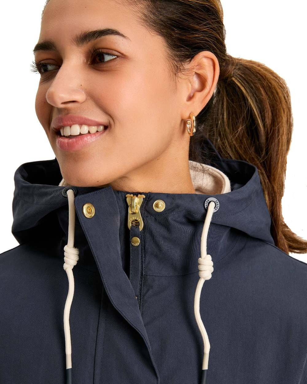 Navy Blue Coloured Joules Portwell Waterproof Raincoat With Hood On A White Background 