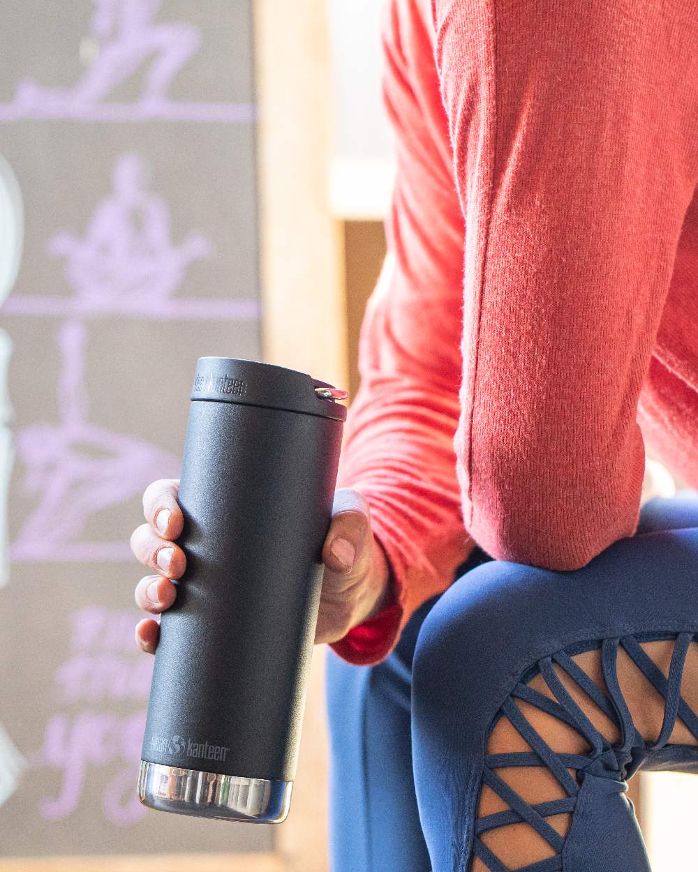 Black Coloured Klean Kanteen Insulated TKWide With Cafe Cap On A House Background 