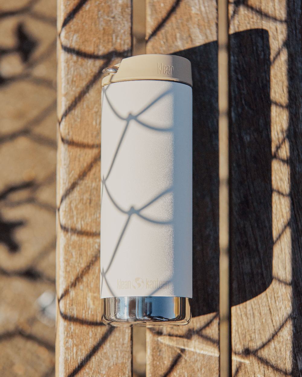 Tofu Coloured Klean Kanteen Insulated TKWide With Cafe Cap On A Wood Background 