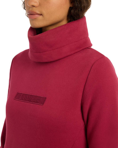 Ember Coloured LeMieux Adele Funnel Neck Sweatshirt On A White Background 