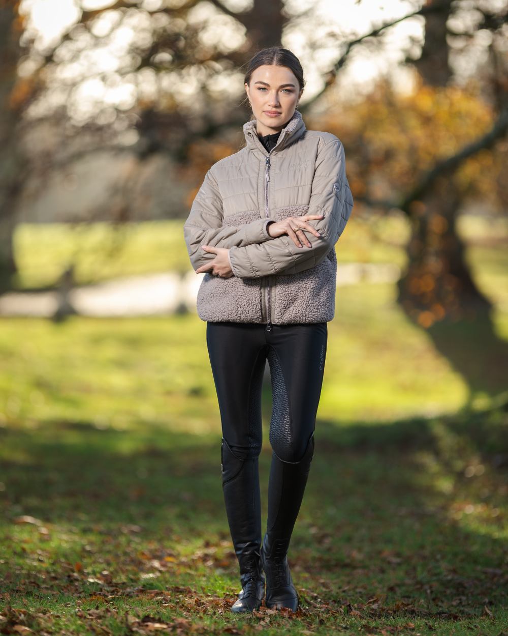 Ash Coloured LeMieux Alissa Hybrid Fleece Jacket On A Front Yard Background 