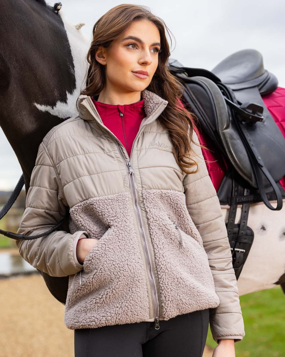 Ash Coloured LeMieux Alissa Hybrid Fleece Jacket On A Front Yard Background 