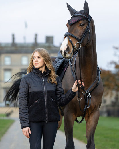 Black Coloured LeMieux Alissa Hybrid Fleece Jacket On A Front Yard Background 