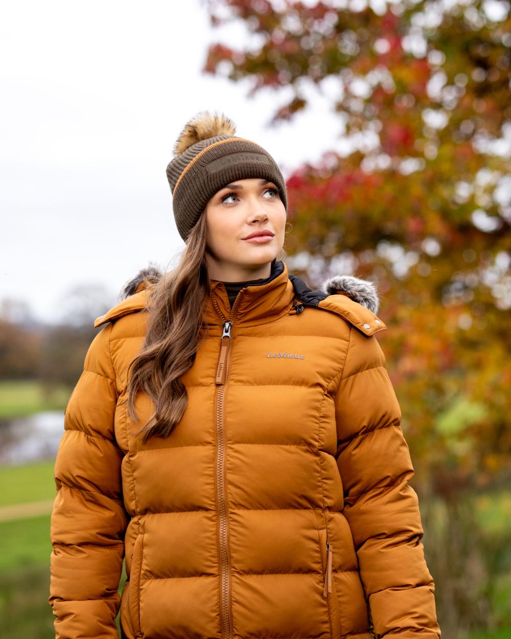 Alpine Coloured LeMieux Clara Cable Beanie On A Garden Background 