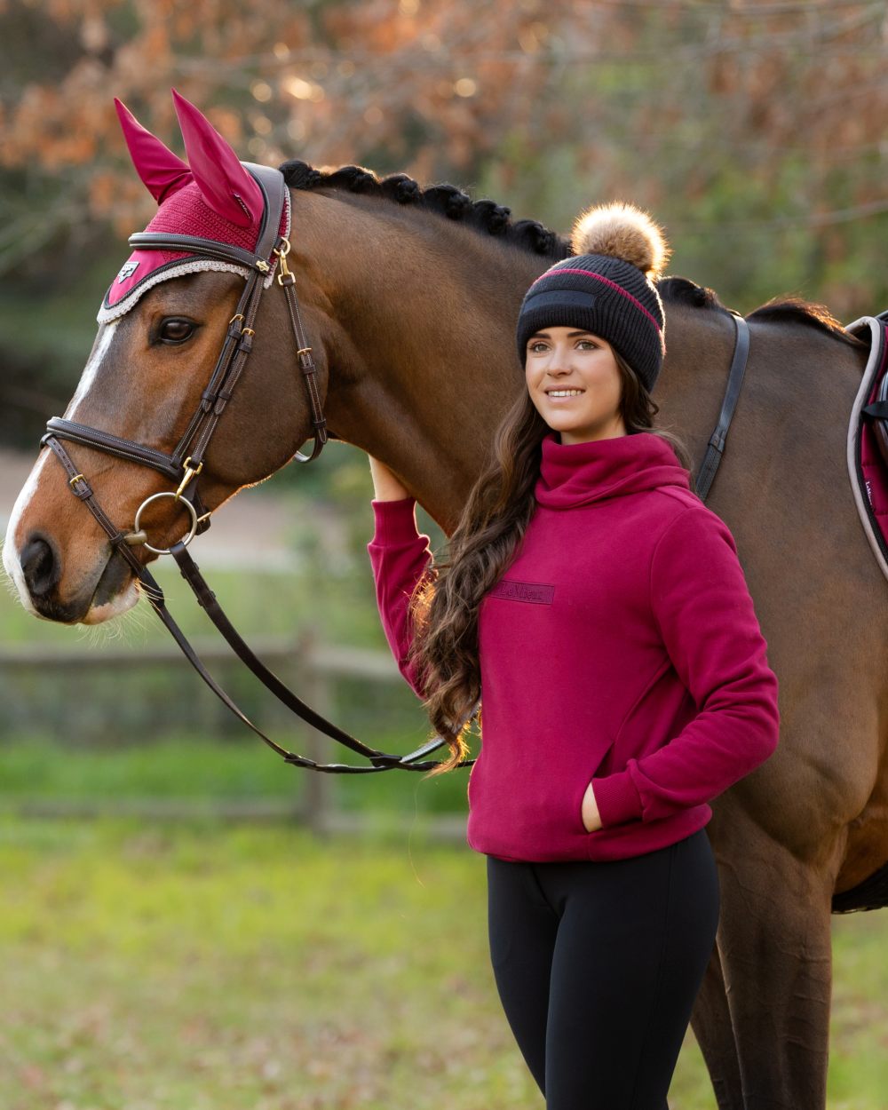 Cinder Coloured LeMieux Clara Cable Beanie On A Outer Yard Background 