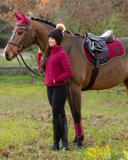 Cinder Coloured LeMieux Clara Cable Beanie On A Outer Yard Background 