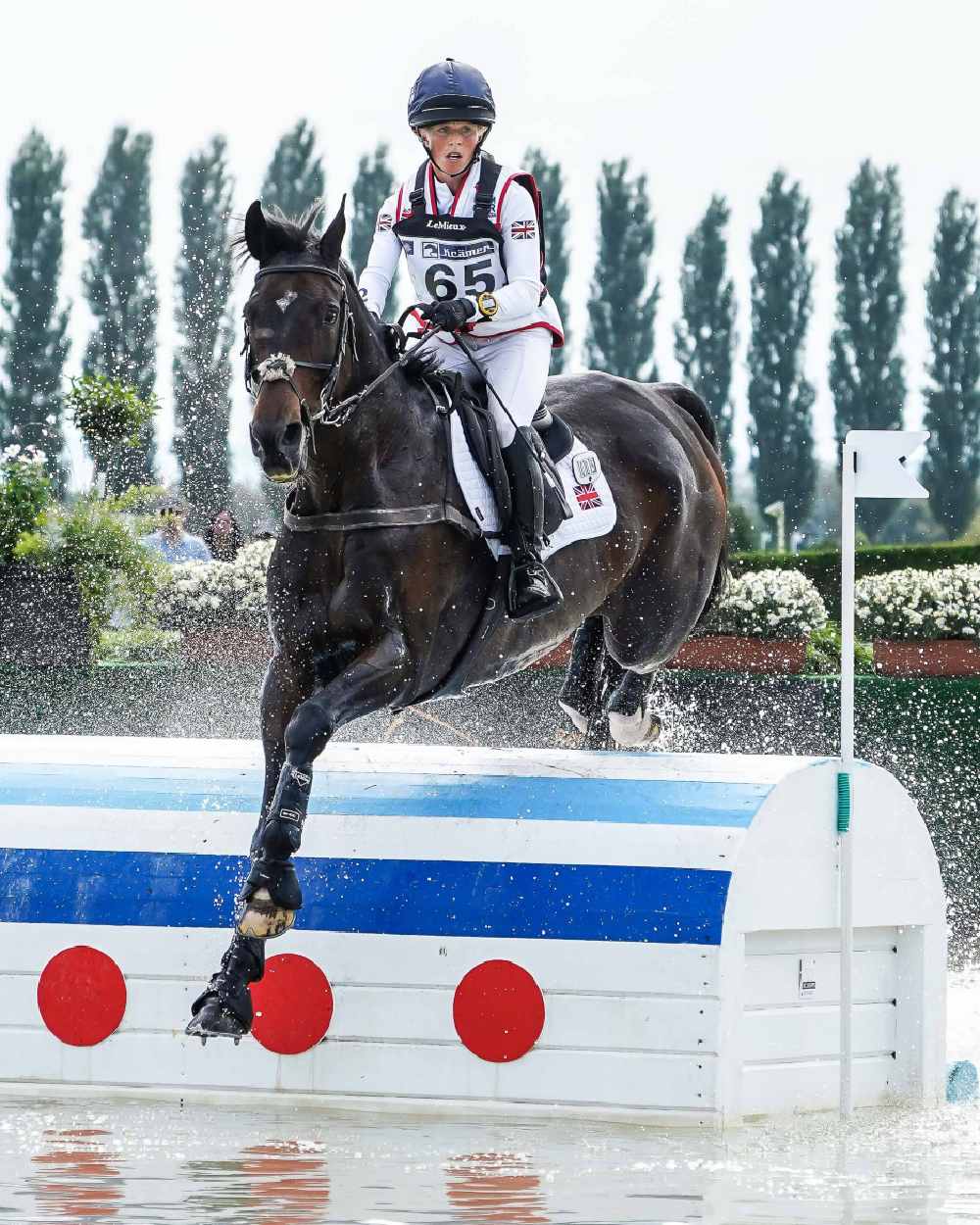 White coloured LeMieux Cotton Close Contact Square on showjumping background 