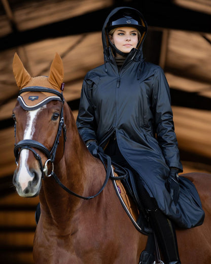 Navy Coloured LeMieux Elements Coat On A Stable Background 