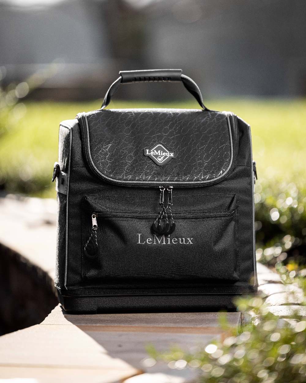Black coloured LeMieux Elite Pro Grooming Bag on blurry background 