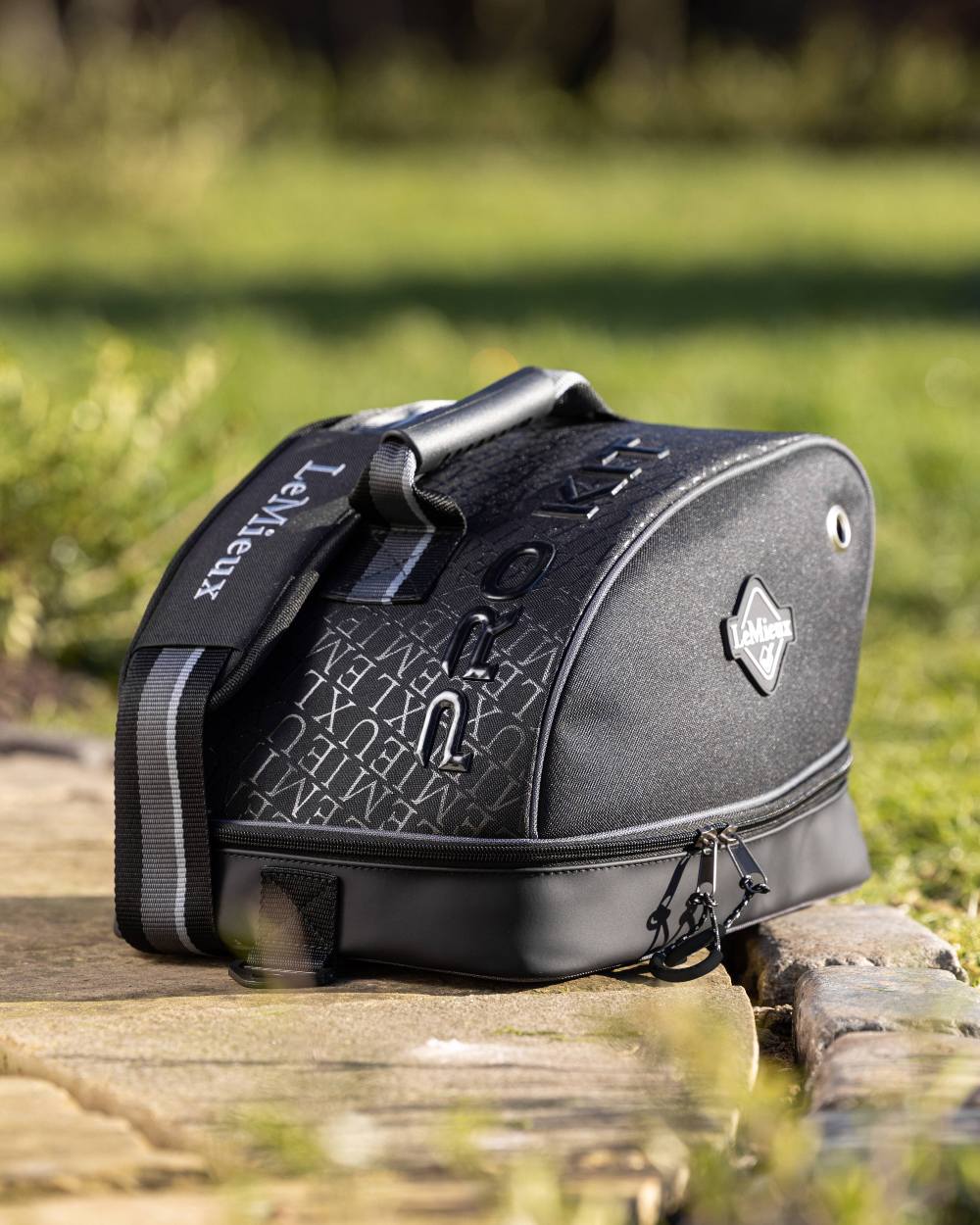 Black coloured LeMieux Elite Pro Hat Box on grass background 