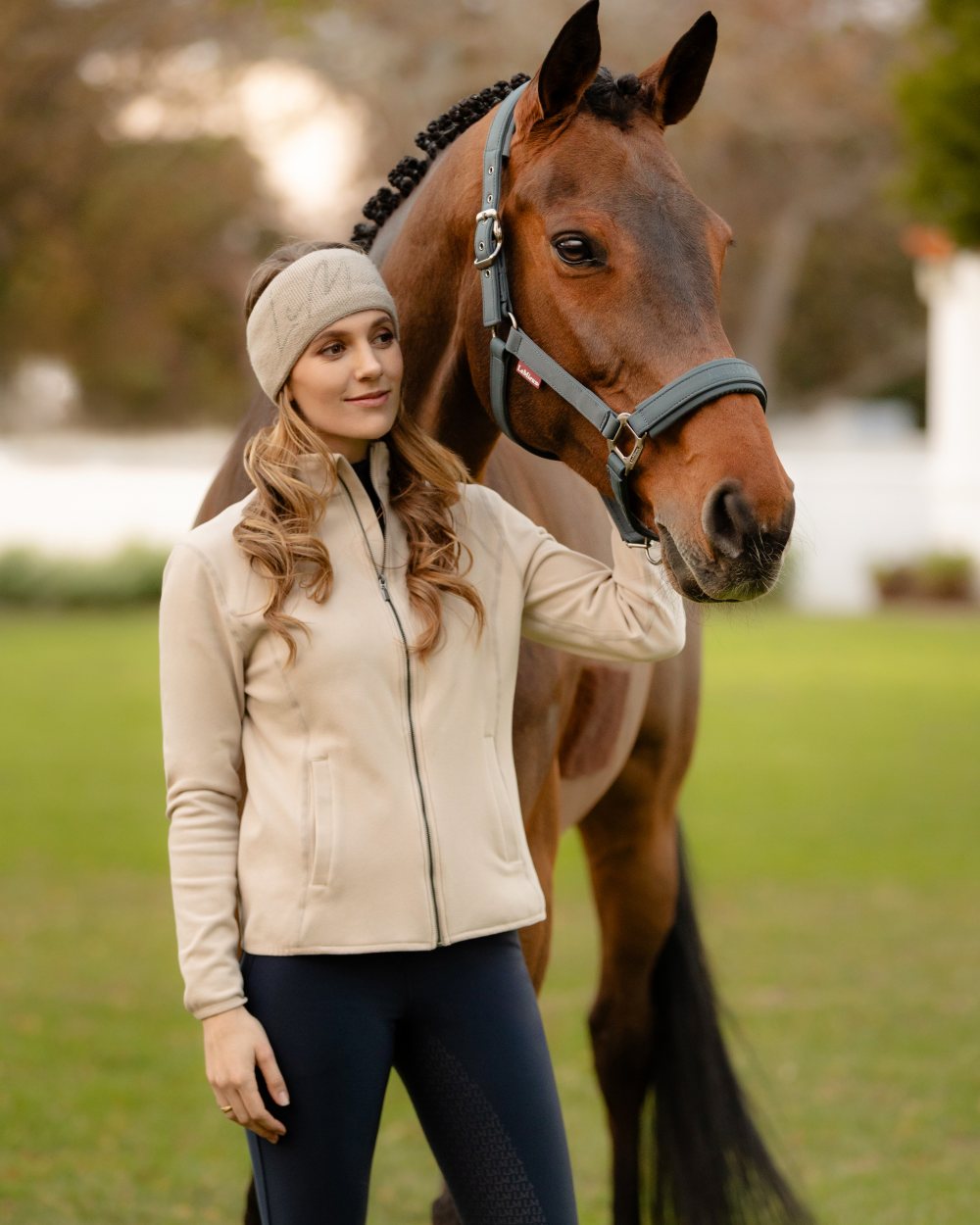 Stone Coloured LeMieux Faye Fleece Zip Through Jacket On A Front Yard Background 