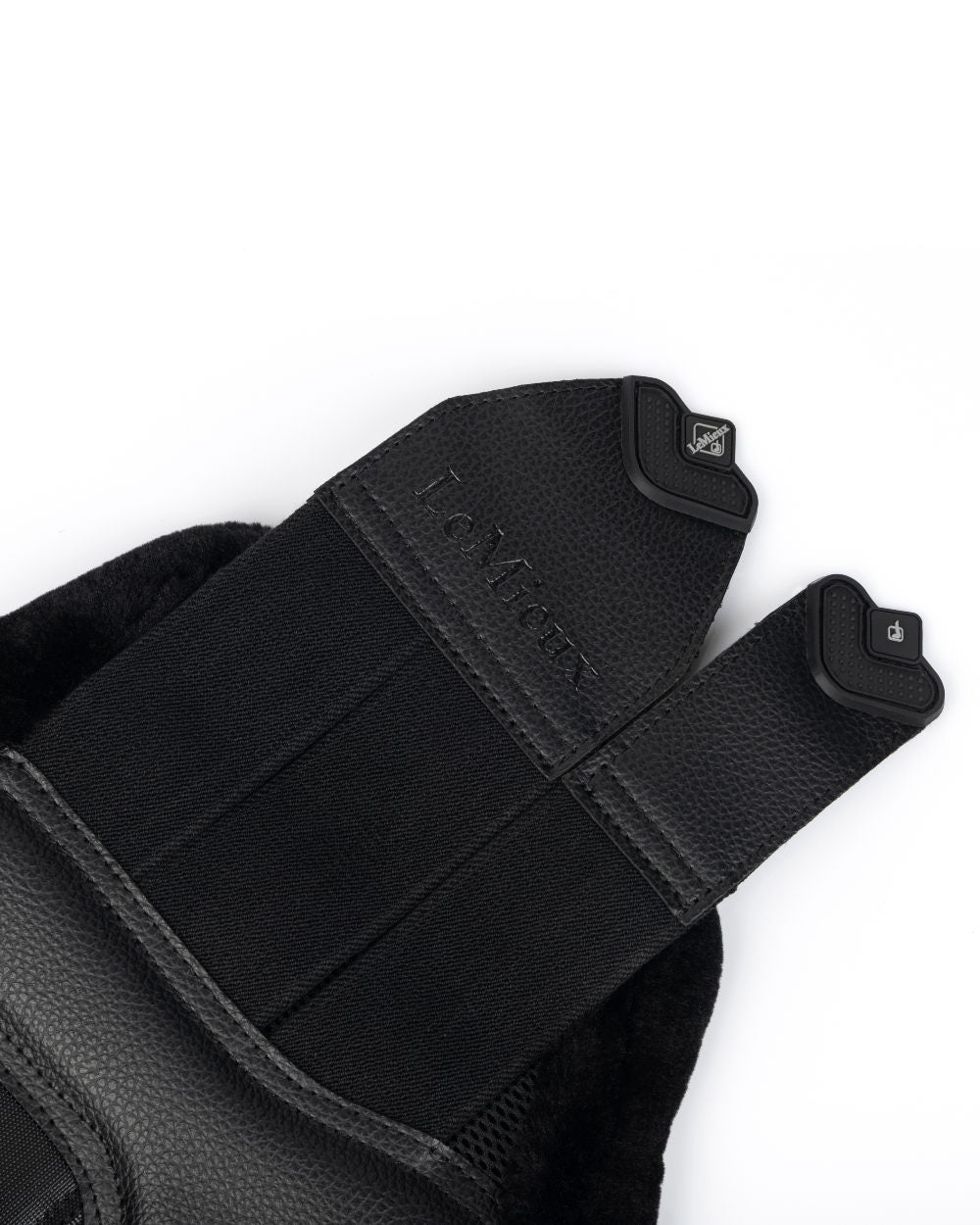 Black coloured LeMieux Fleece Edged Mesh Brushing Boots on white background 