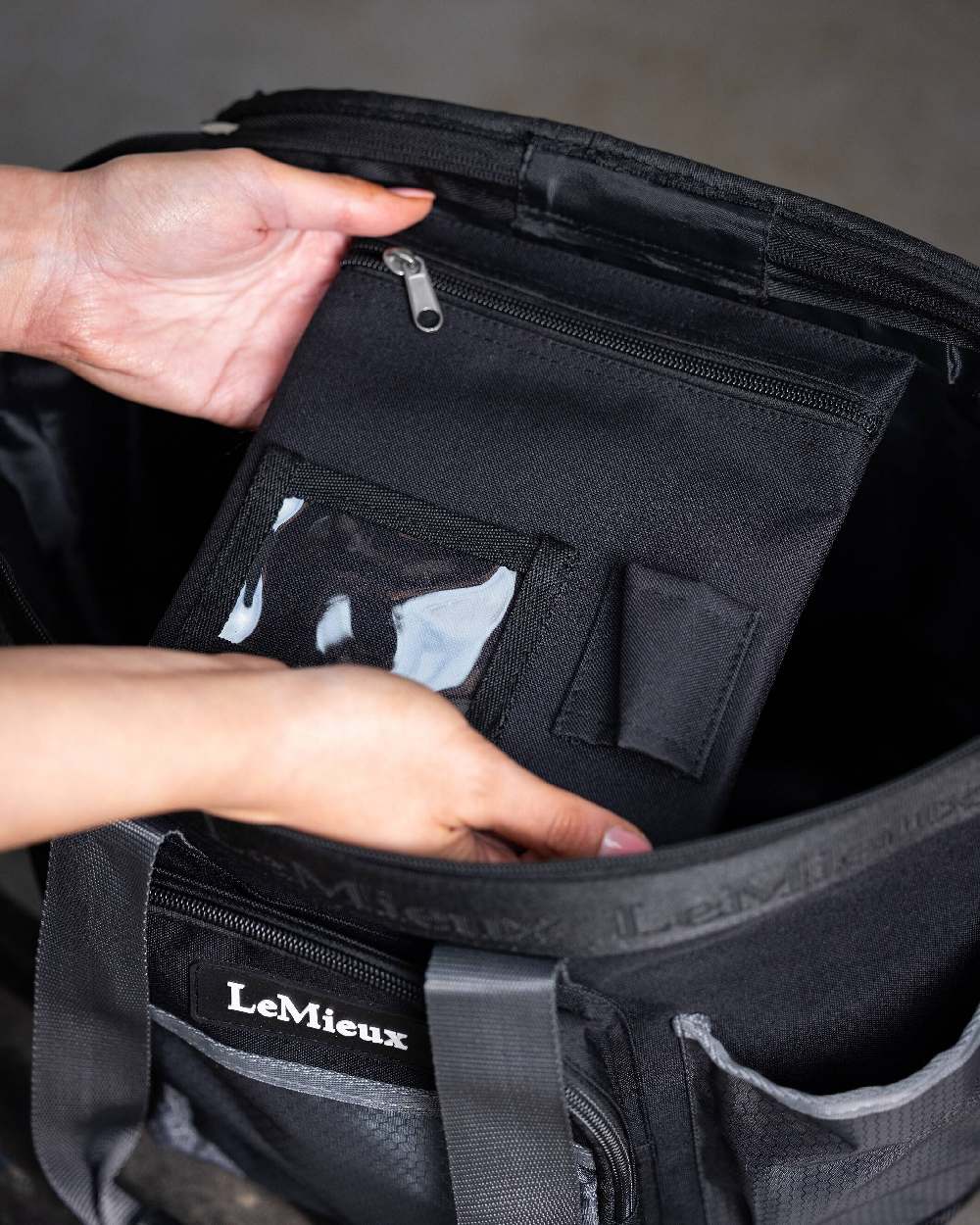 Black coloured LeMieux Grooming Bag on blurry background 