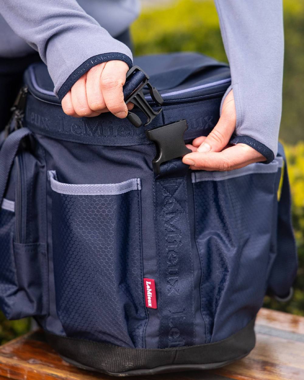 Navy coloured LeMieux Grooming Bag on blurry background 