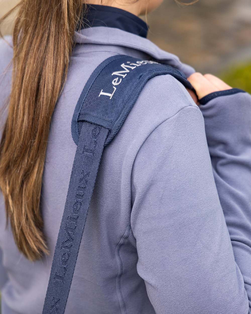 Navy coloured LeMieux Grooming Bag on blurry background 