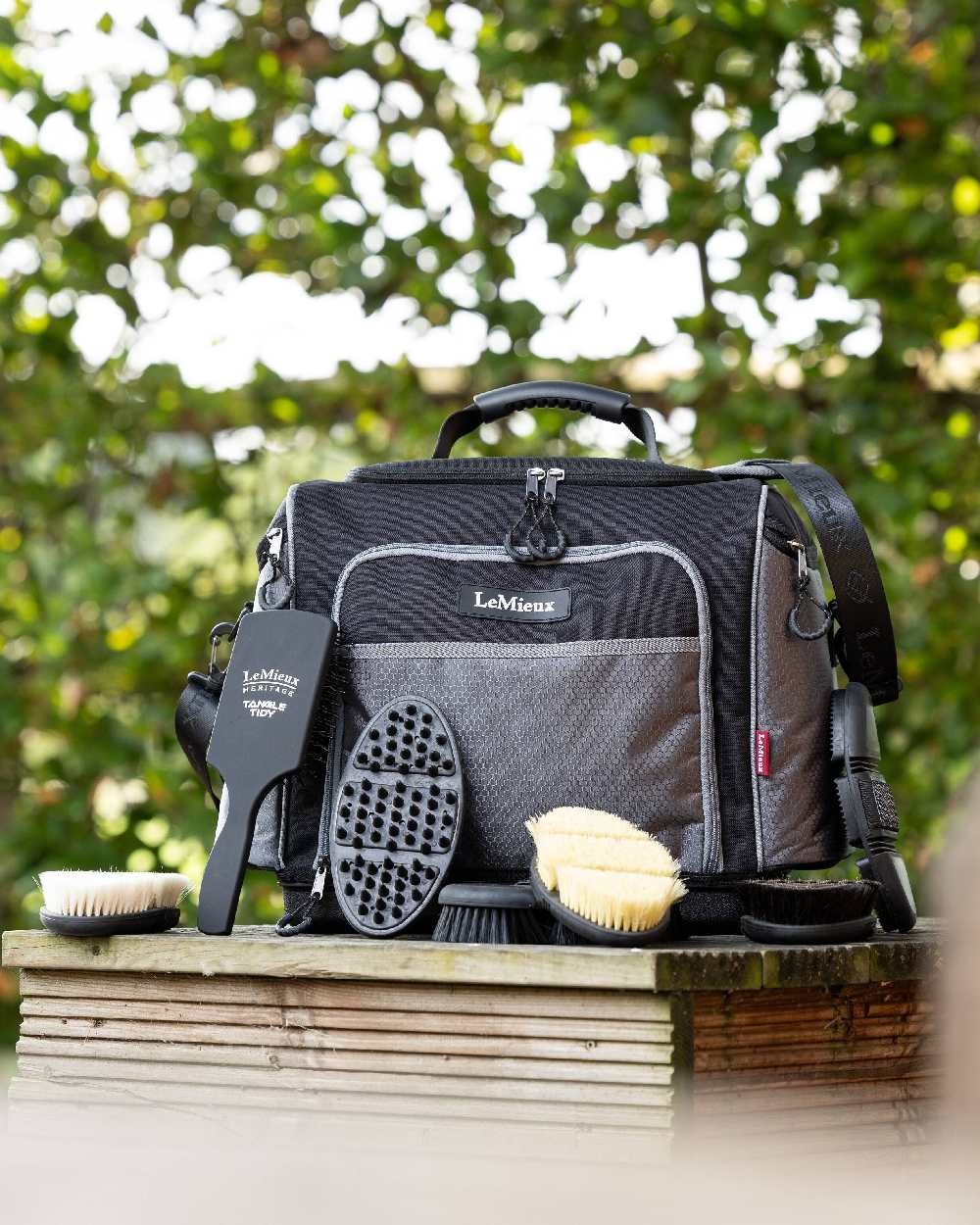 Black coloured LeMieux Grooming Kit Pro with Tree in background 