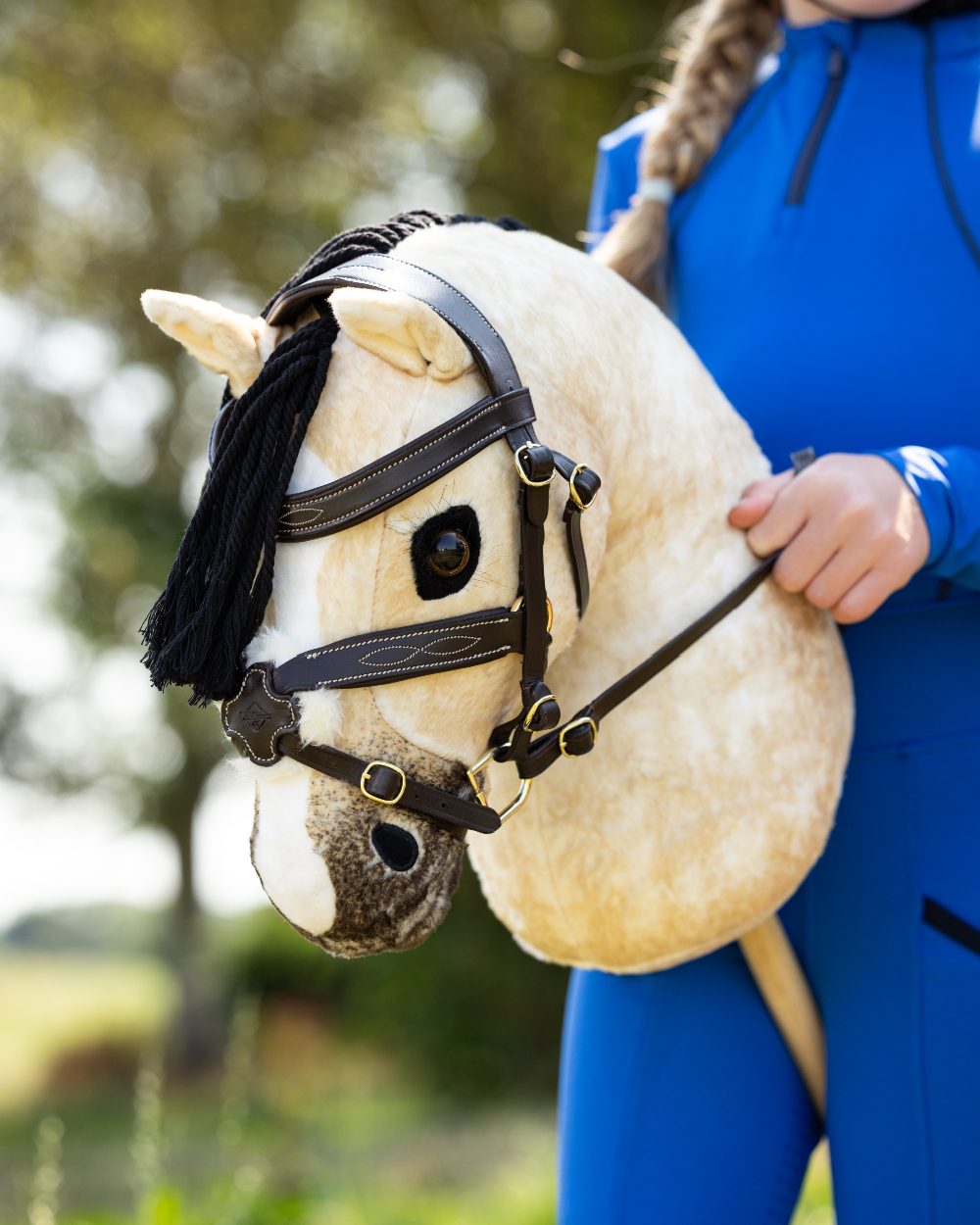 Dream Coloured LeMieux Hobby Horse On A Outer Yard Background 