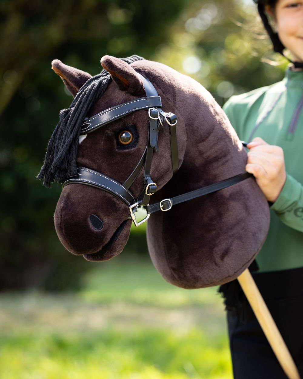 Freya Coloured LeMieux Hobby Horse On A Outer Yard Background 