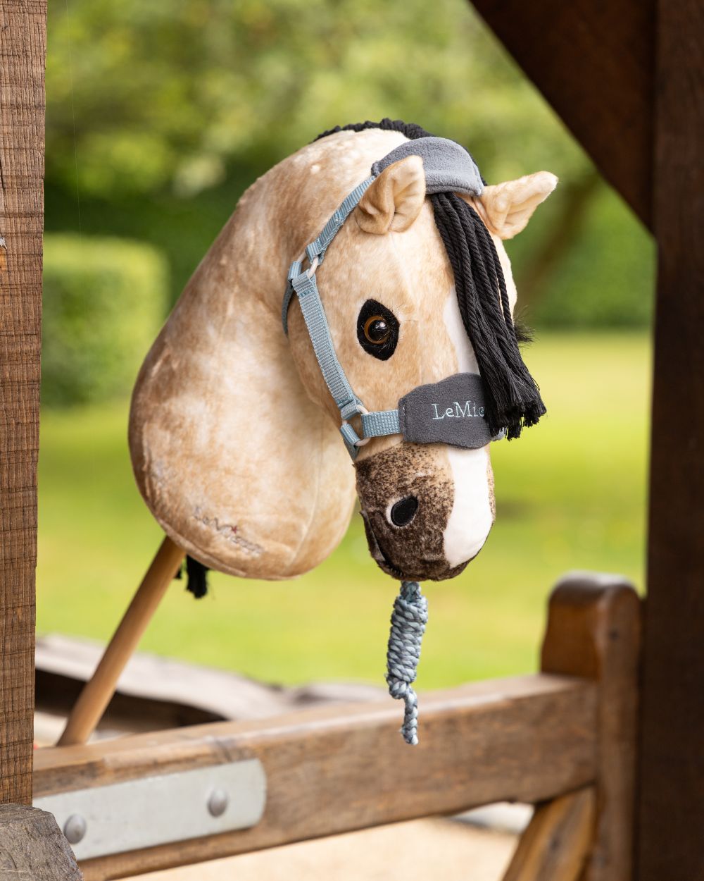 Glacier Coloured LeMieux Hobby Horse Vogue Headcollar On A Outer Yard Background 