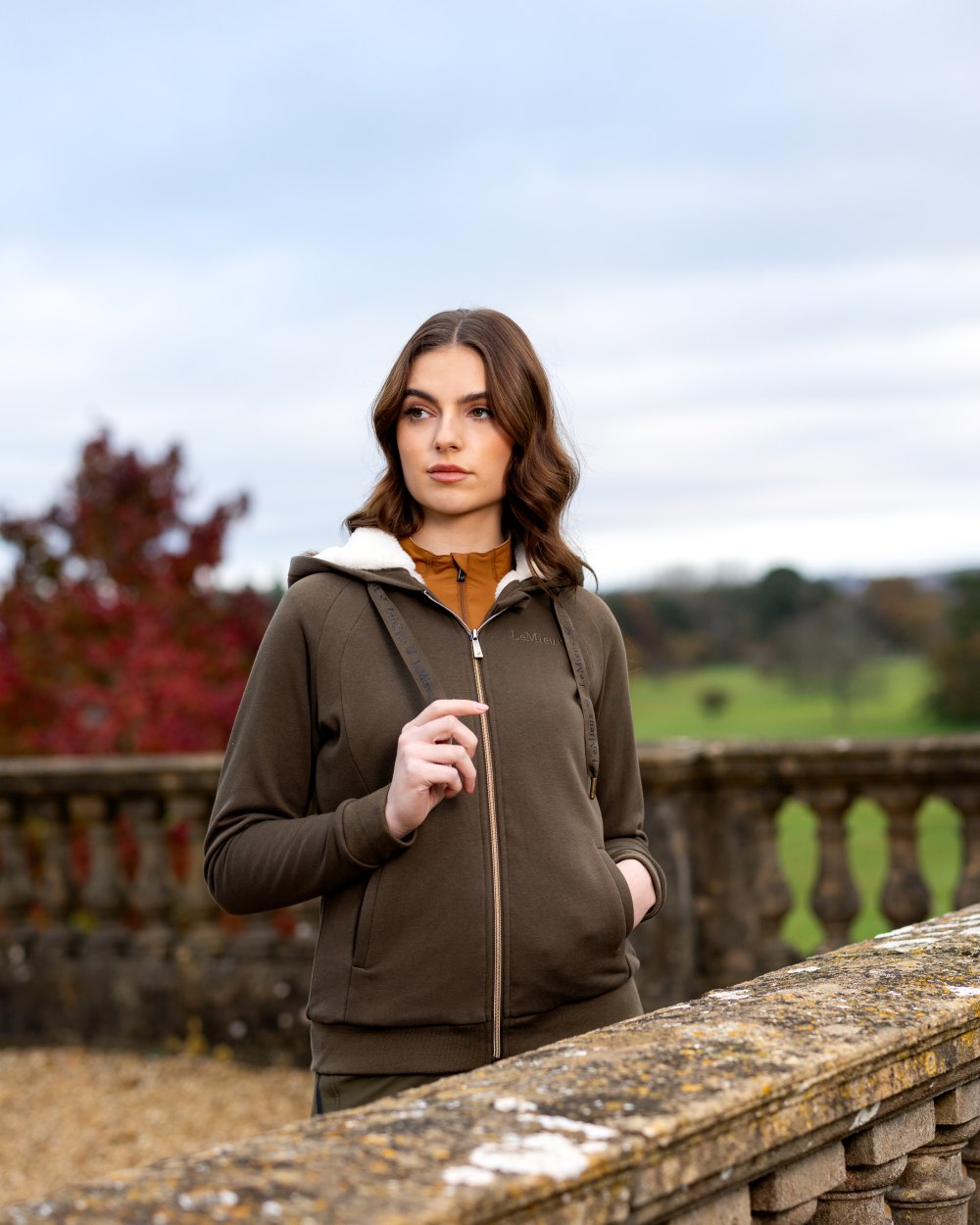 Alpine Coloured LeMieux Leia Lined Hoodie On A Front Yard Background 