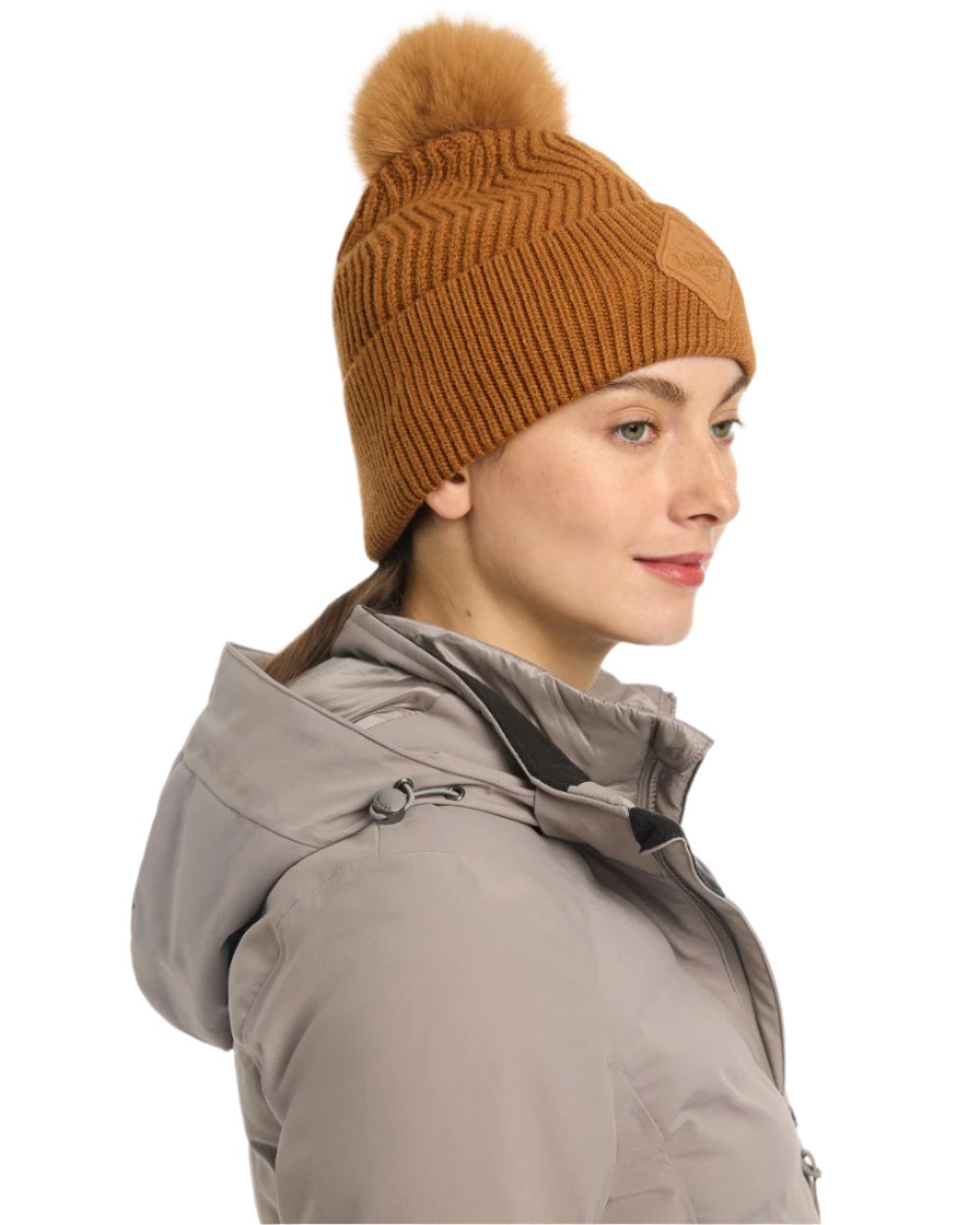 Ginger Coloured LeMieux Lila Beanie On A White Background 