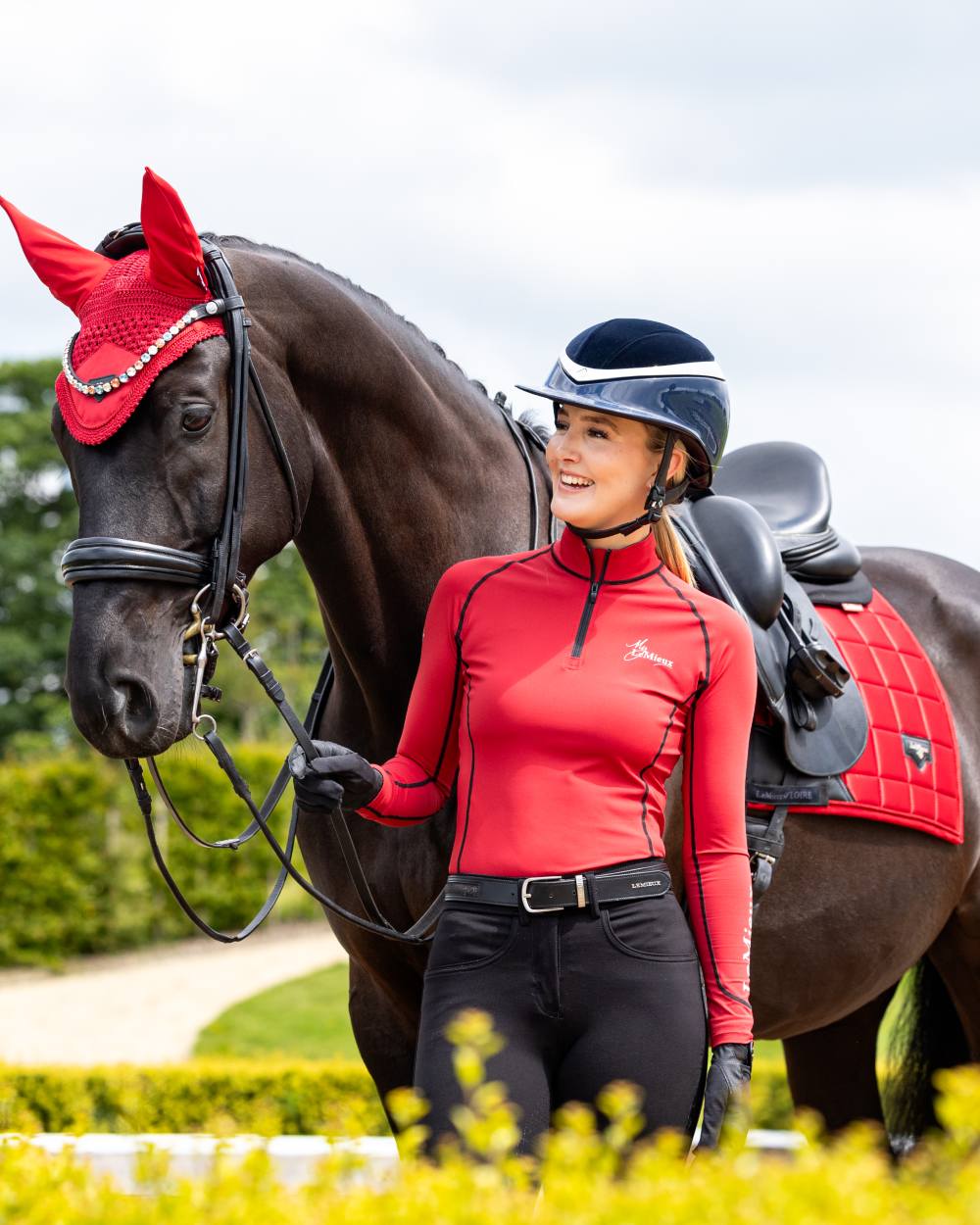 Chilli Coloured LeMieux Loire Dressage Square On A Riding Arena Background 