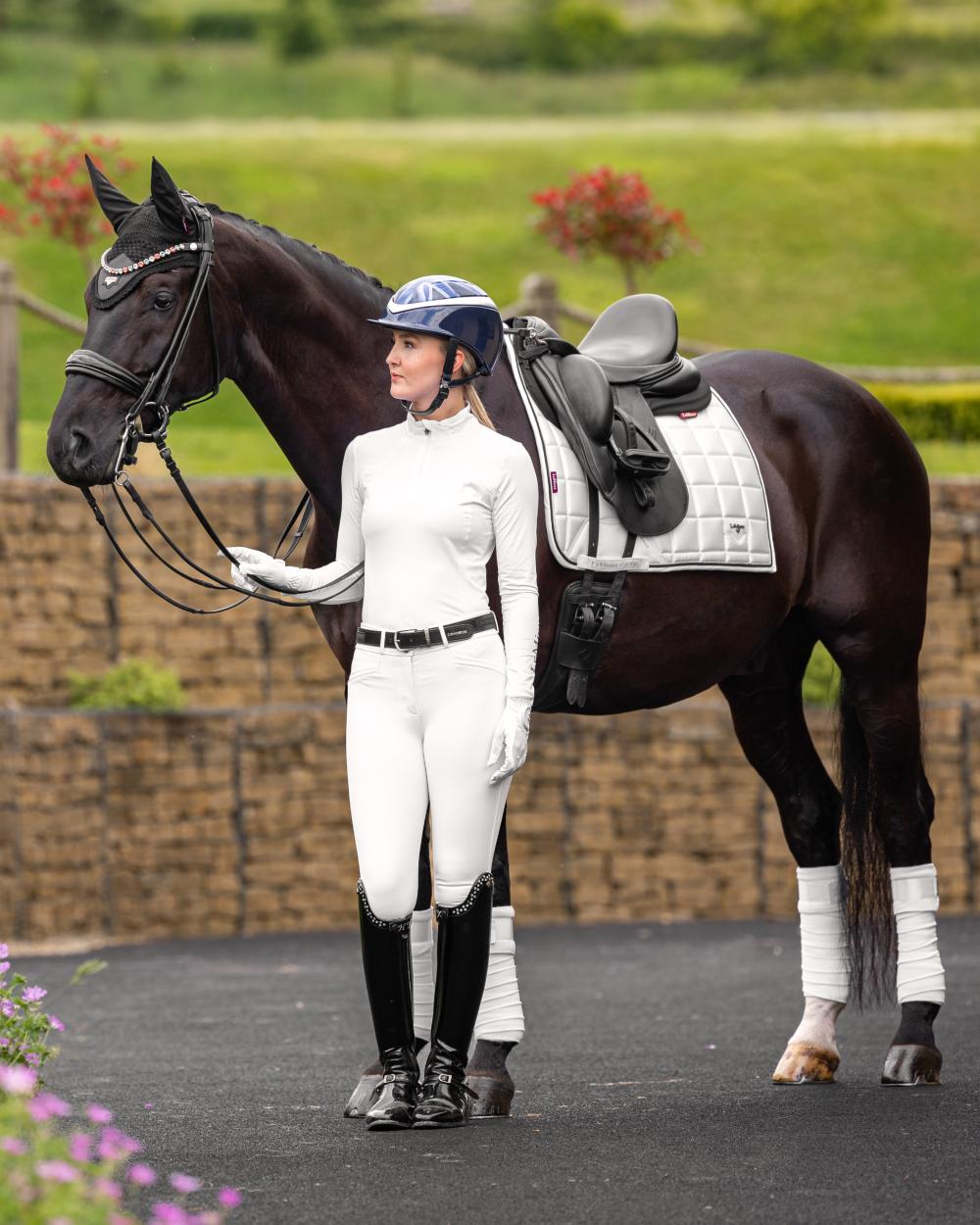 White Coloured LeMieux Loire Dressage Square On A Riding Arena Background 