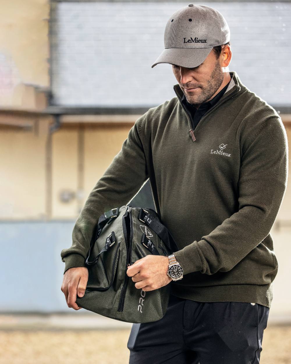 Grey coloured LeMieux Mesh Baseball Cap on industrial background 