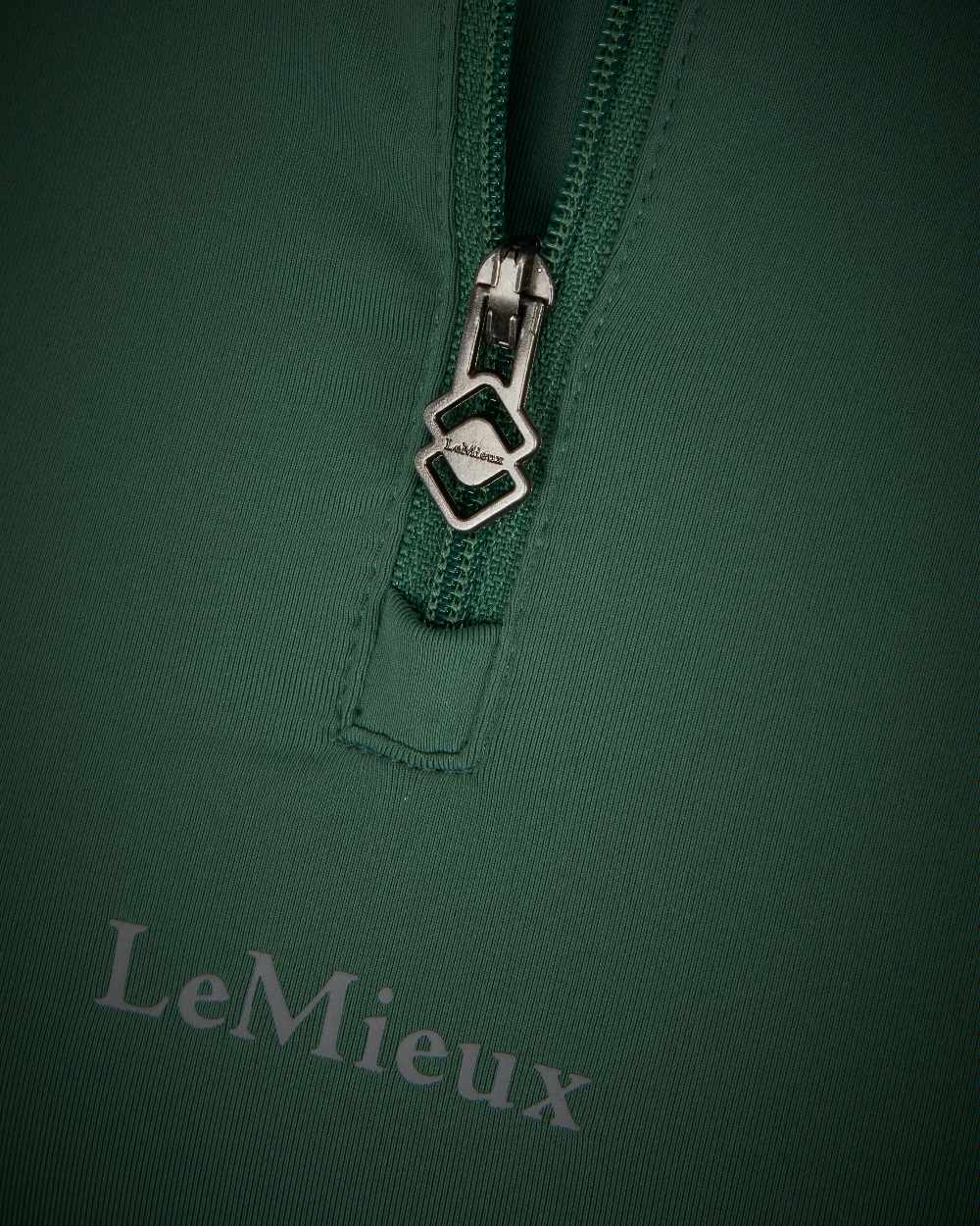 Hunter Green coloured LeMieux Mia Mesh Short Sleeve Base Layer on white background 