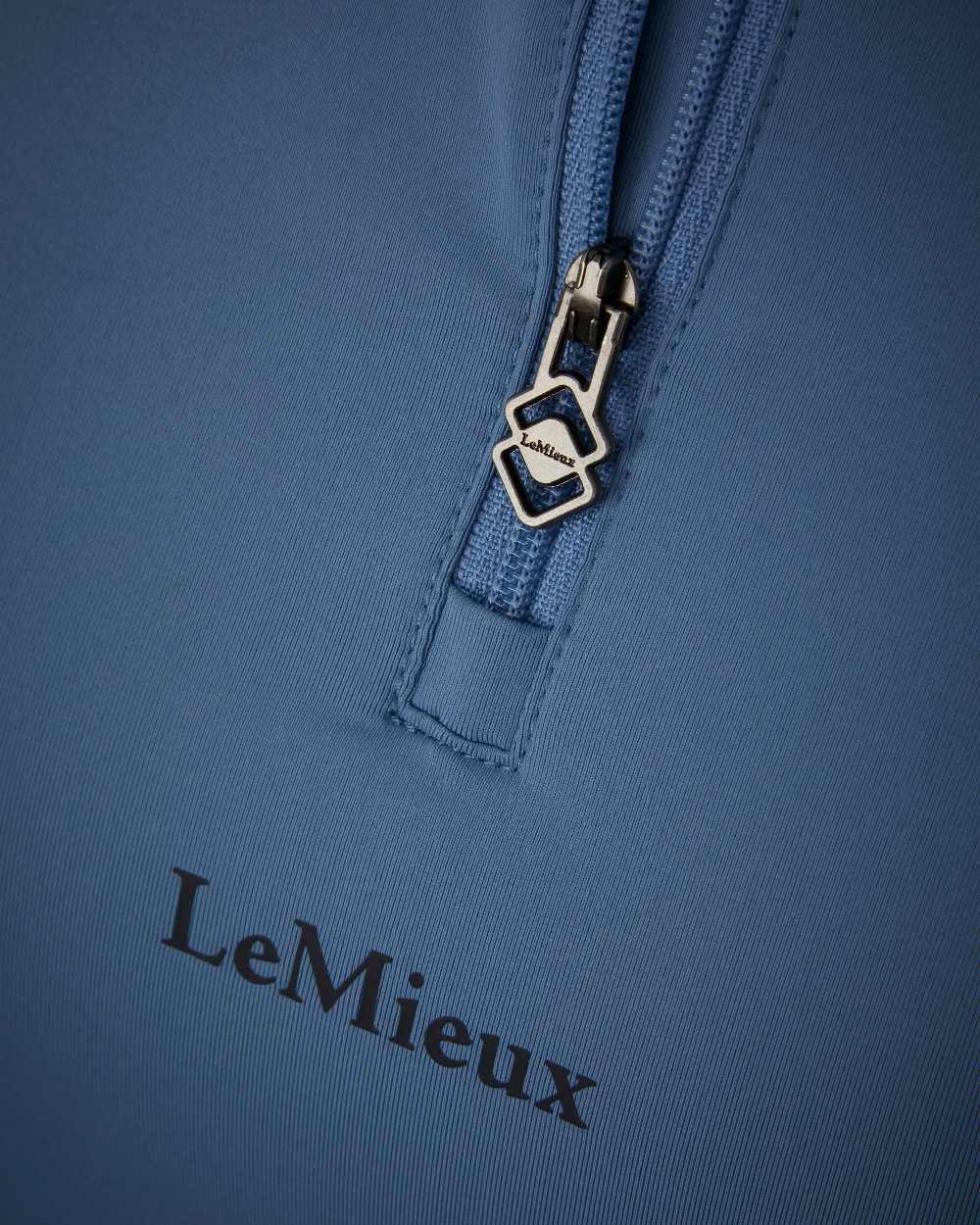 Ice Blue coloured LeMieux Mia Mesh Short Sleeve Base Layer on white background 