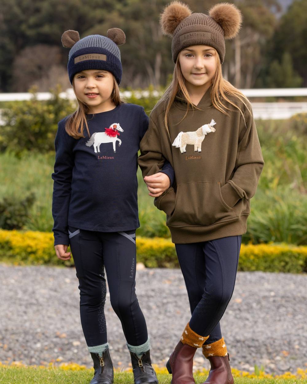 Petrol Coloured LeMieux Mini Bear Beanie On A Park Background 